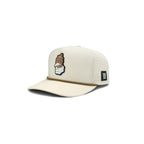Grip snapback golf hat in cream, angled view