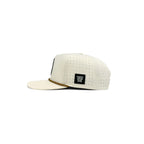 Grip snapback golf hat in cream, side view